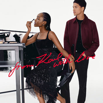 Woman applying makeup with a man standing behind her, featuring 'From Karl with Love' text.