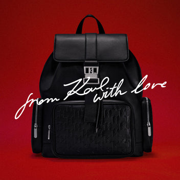 Black backpack with 'K' logo on a red background with 'From Karl with love' text.
