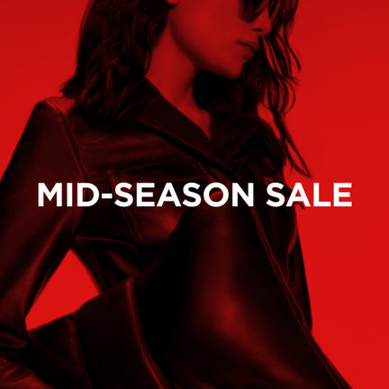 Person wearing a coat with 'Mid-Season Sale' text on a red background