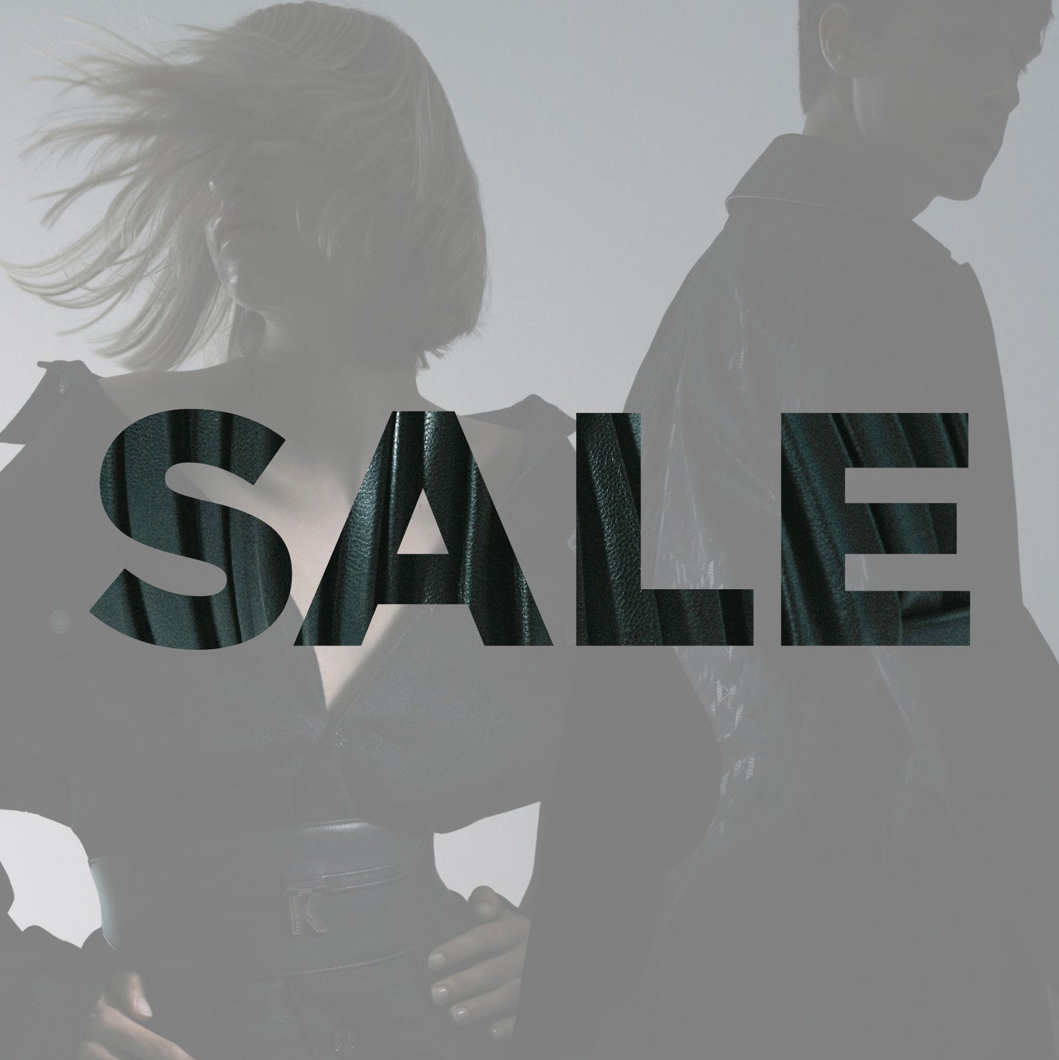 Two people holding hands with 'SALE' text overlay on a gray background