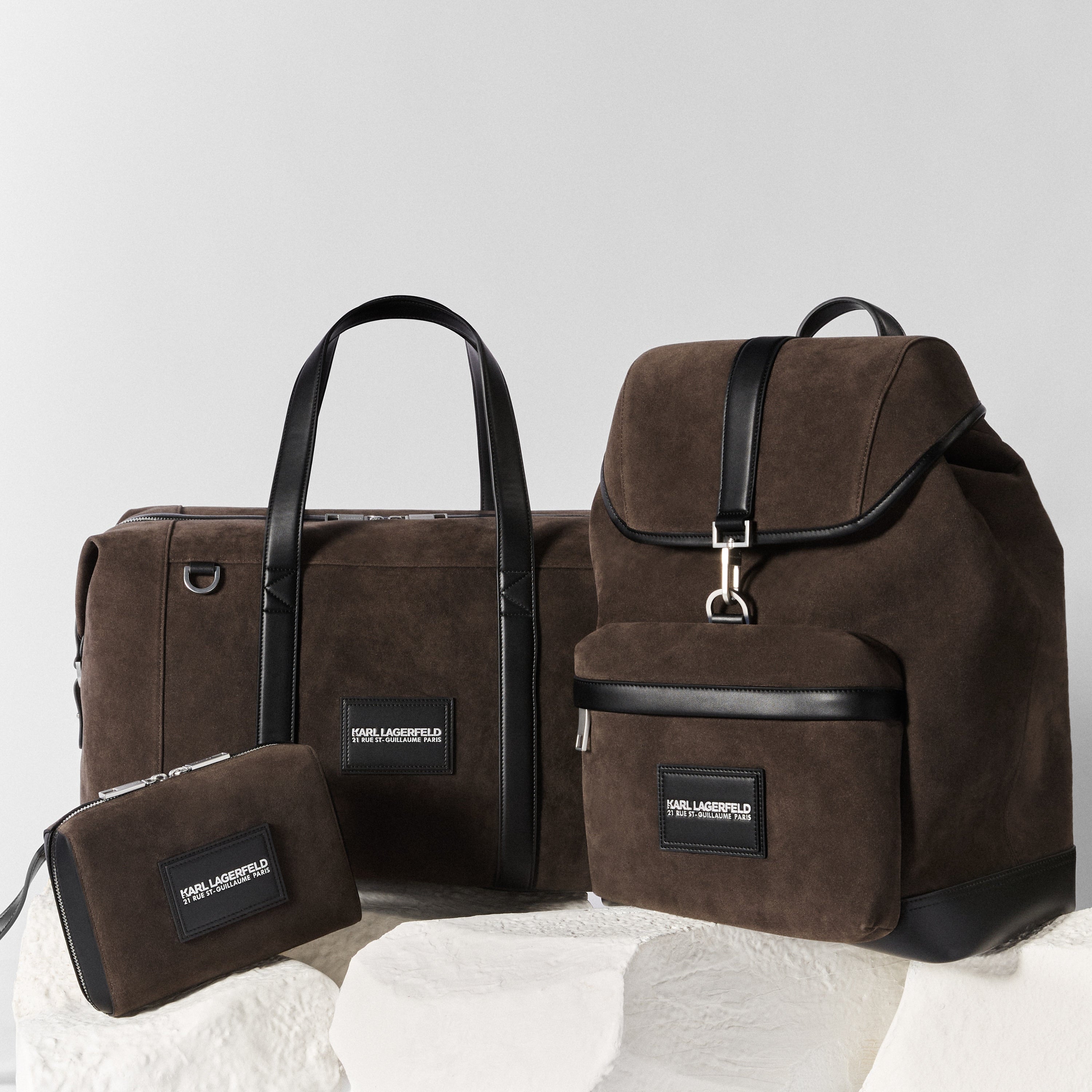Set of brown bags with black accents on a light gray background
