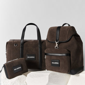 Set of brown bags with black accents on a light gray background